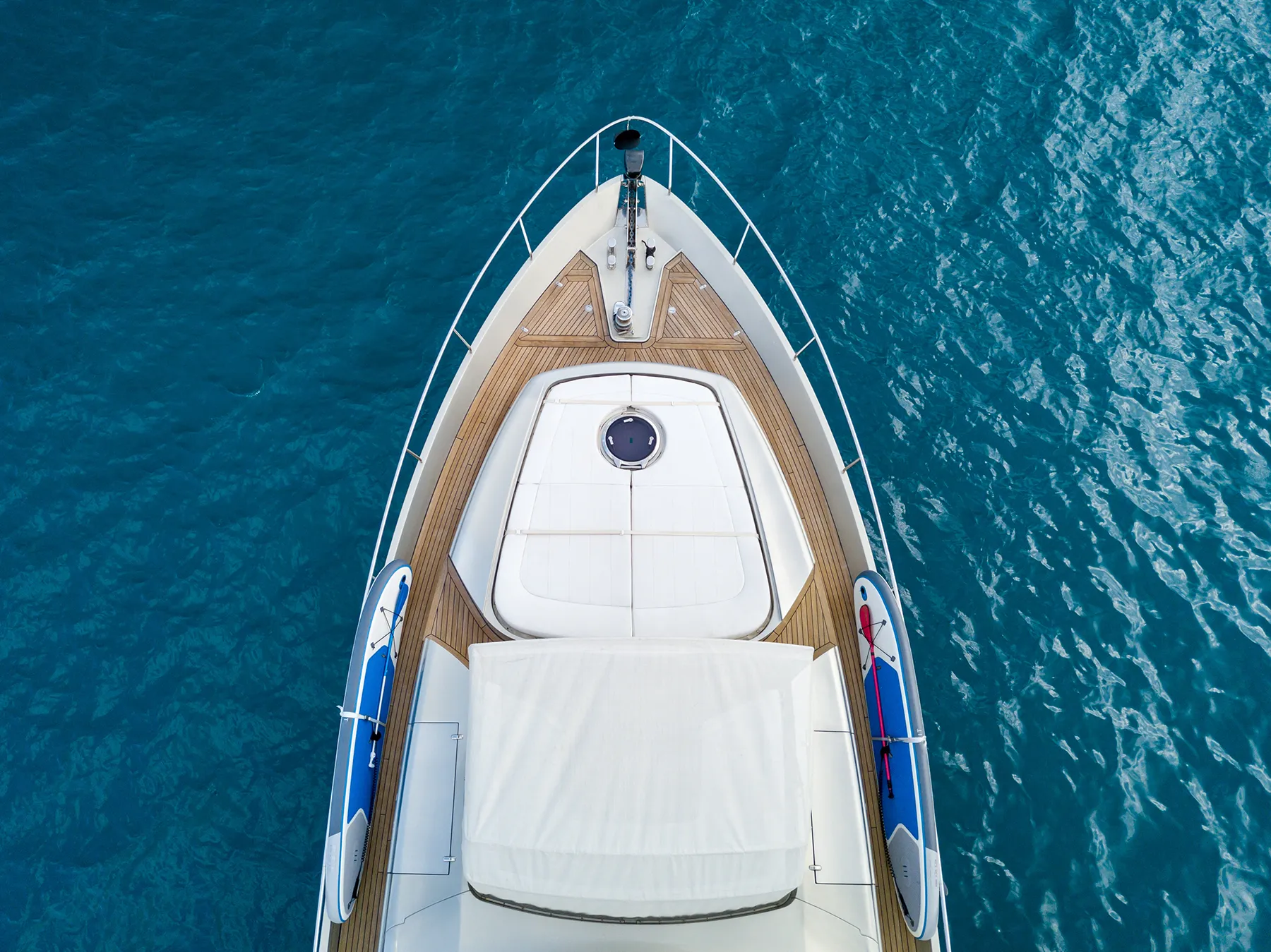 Aerial shot of a yacht sailing on the sea