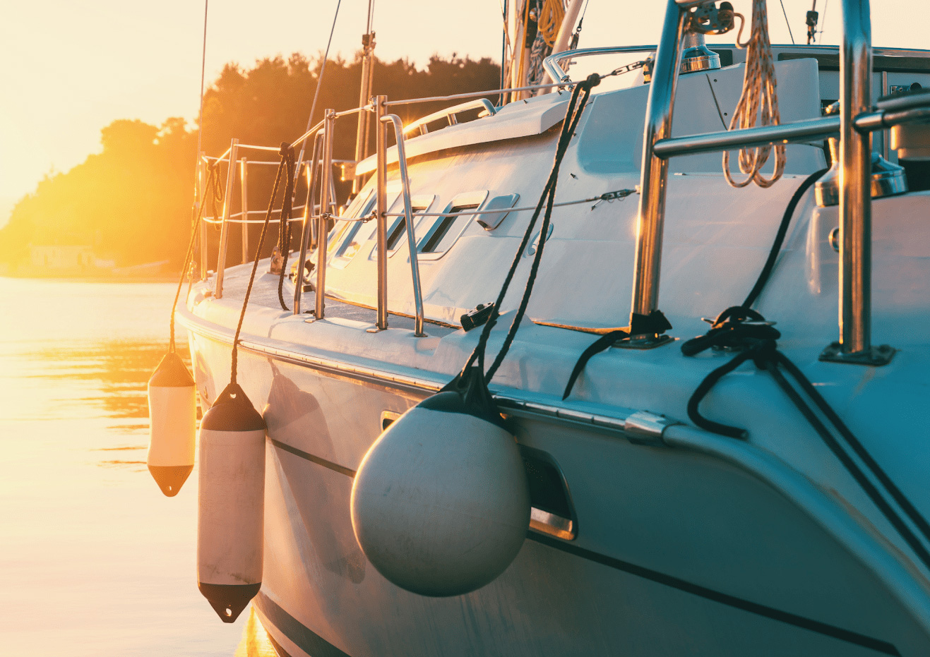 photo of a sailboat during a sunset