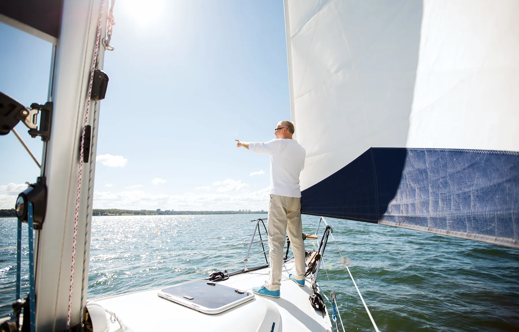 Sailing, Age, Tourism, Travel And People Concept – Senior Man On Sail Boat Or Yacht Floating In Sea Sailing, Age, Tourism, Travel And People Concept - Senior Man On Sail Boat Or Yacht Floating In Sea