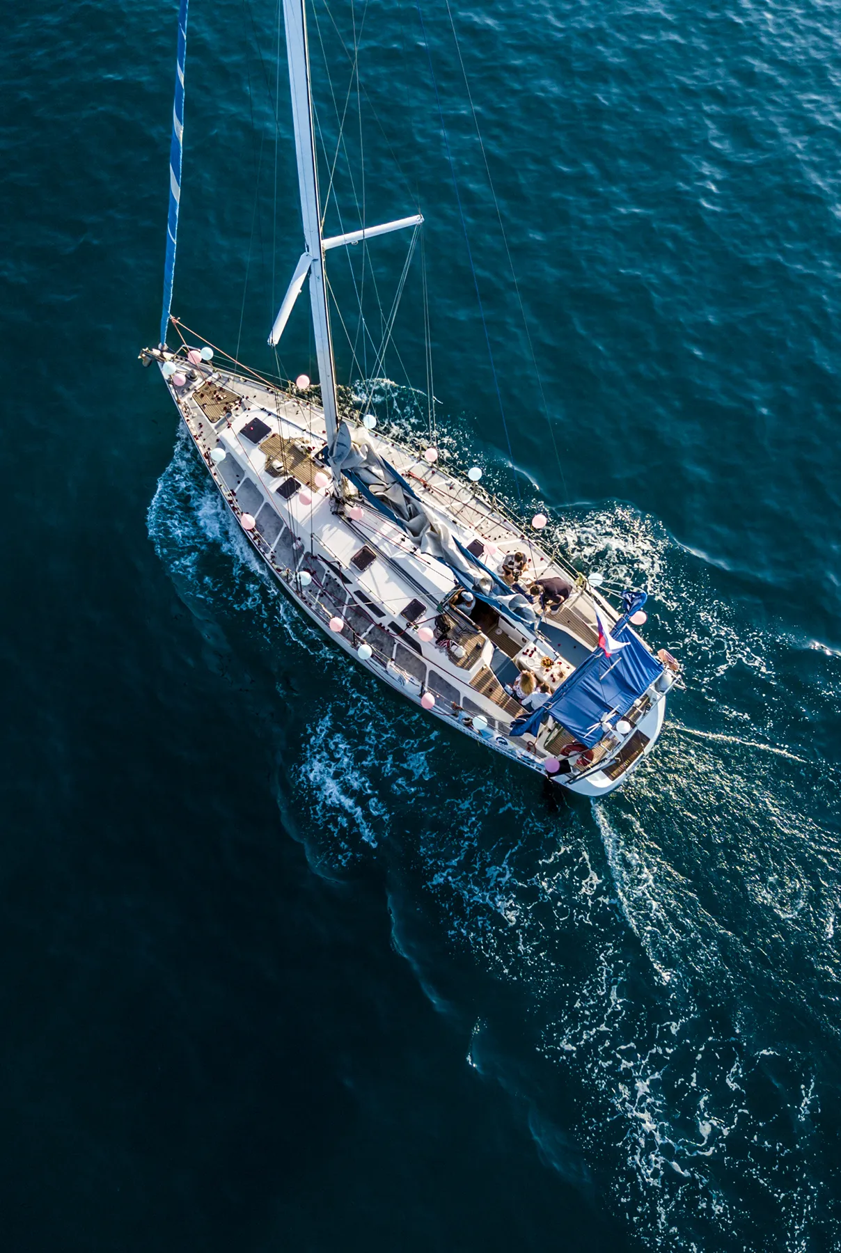 overhead top aerial view of luxury sail boat in the crystal clear blue sea water lagoon overhead top aerial view of luxury sail boat in the crystal clear blue sea water lagoon
