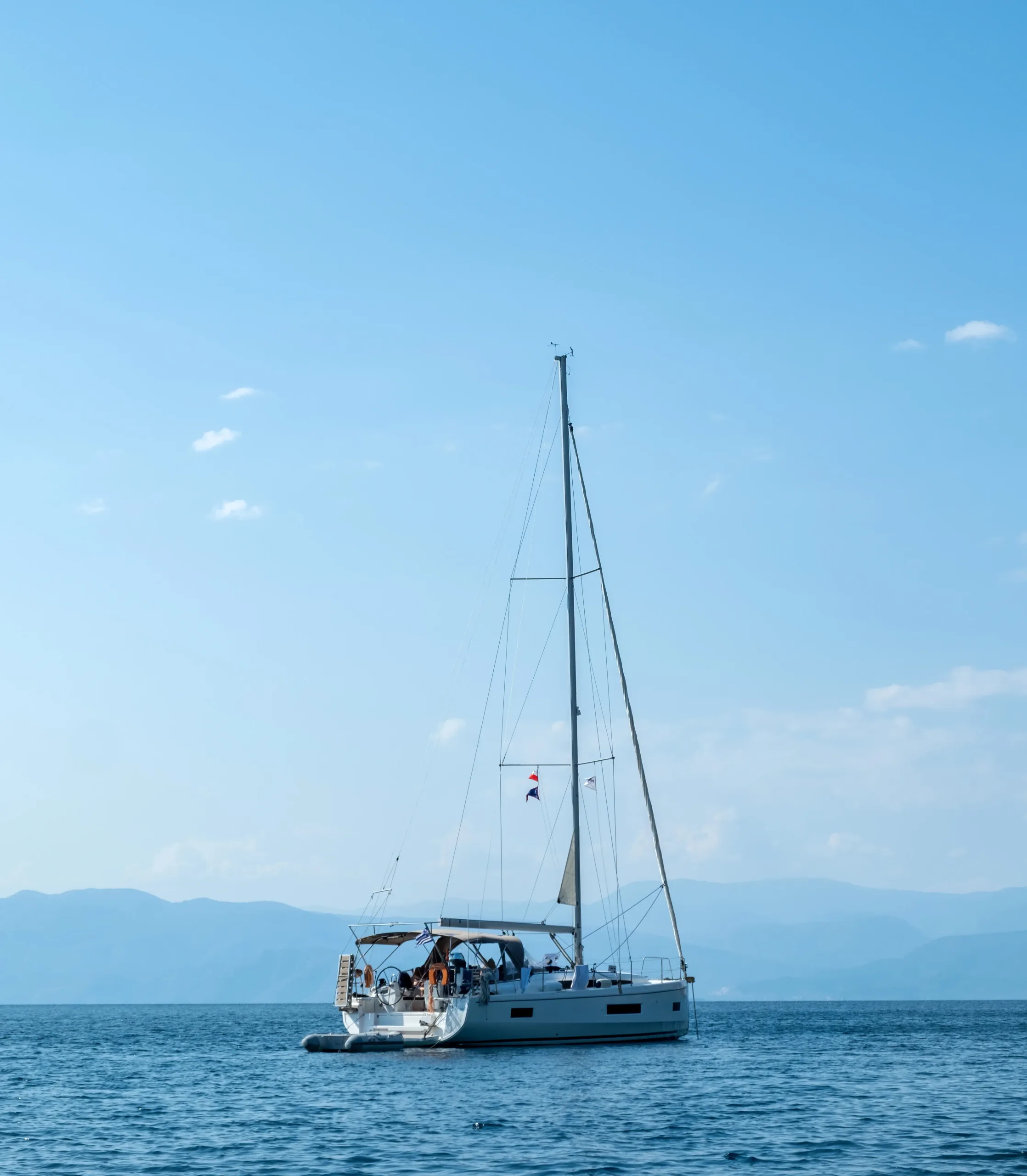Summer vacation destination Greece. Luxury white yacht moored in open vast Aegean sea water. Summer vacation destination Greece. Luxury white yacht moored in open vast Aegean sea water.